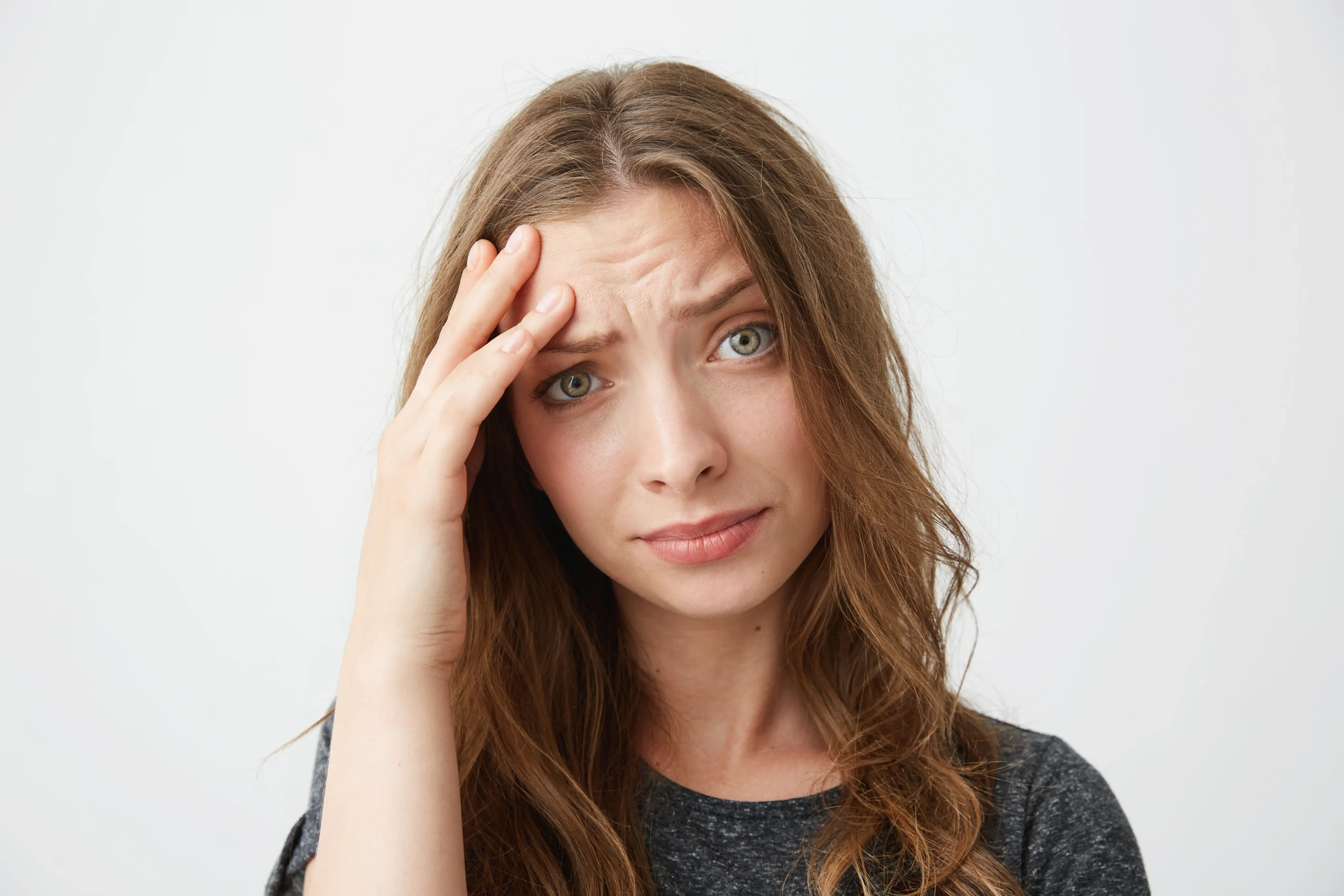 Close up of women insecure about her forehead wrinkles