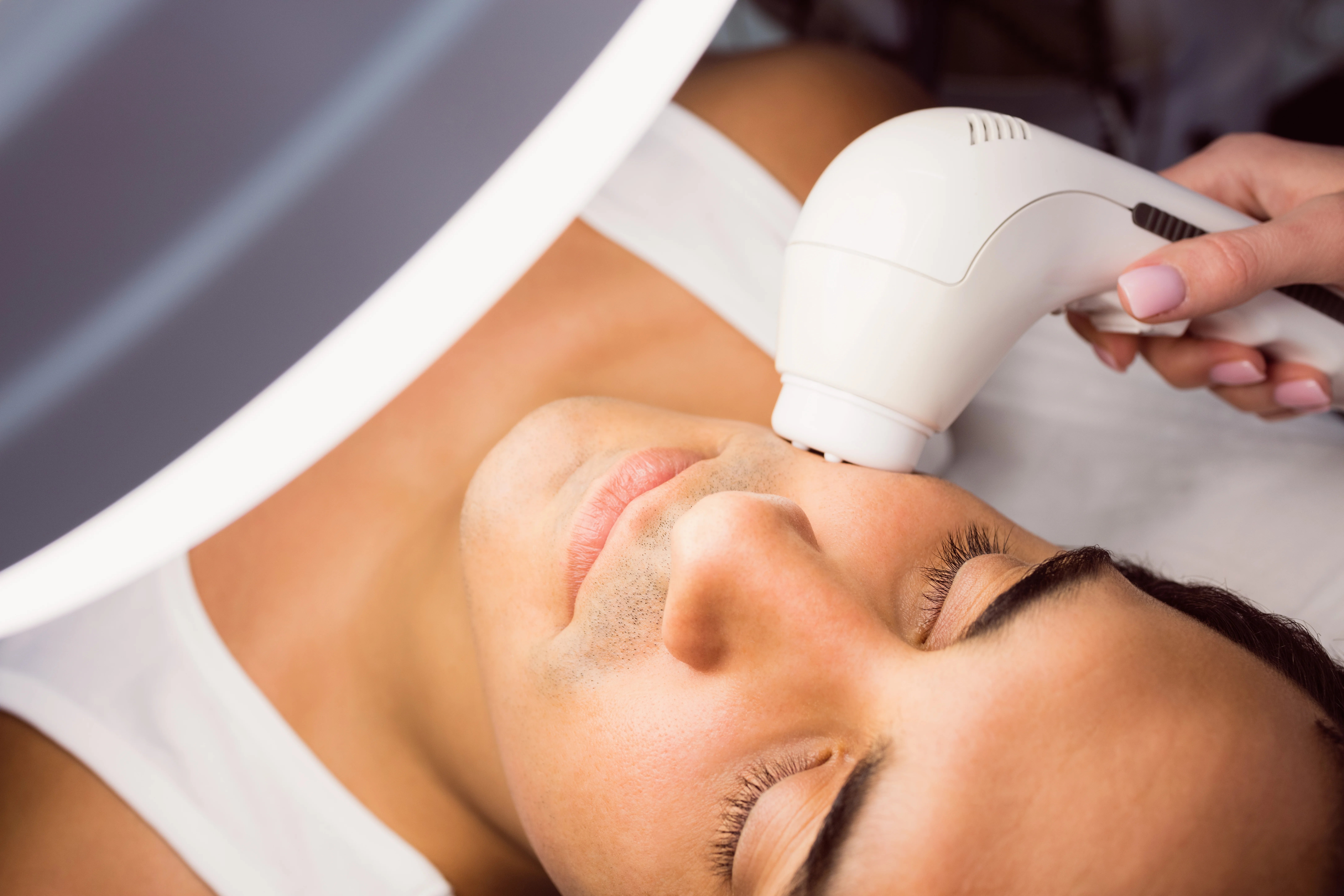 Man getting BBL laser treatment for acne