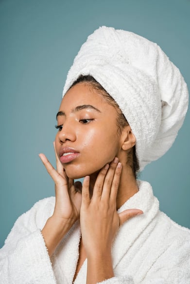 Women applying retinol for skin
