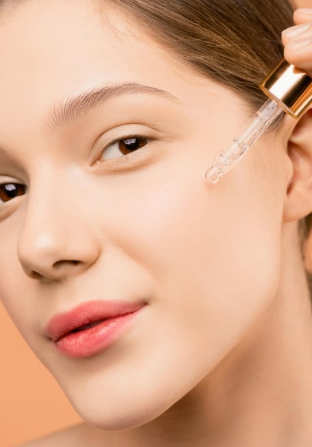 lady using retinol​ oil
