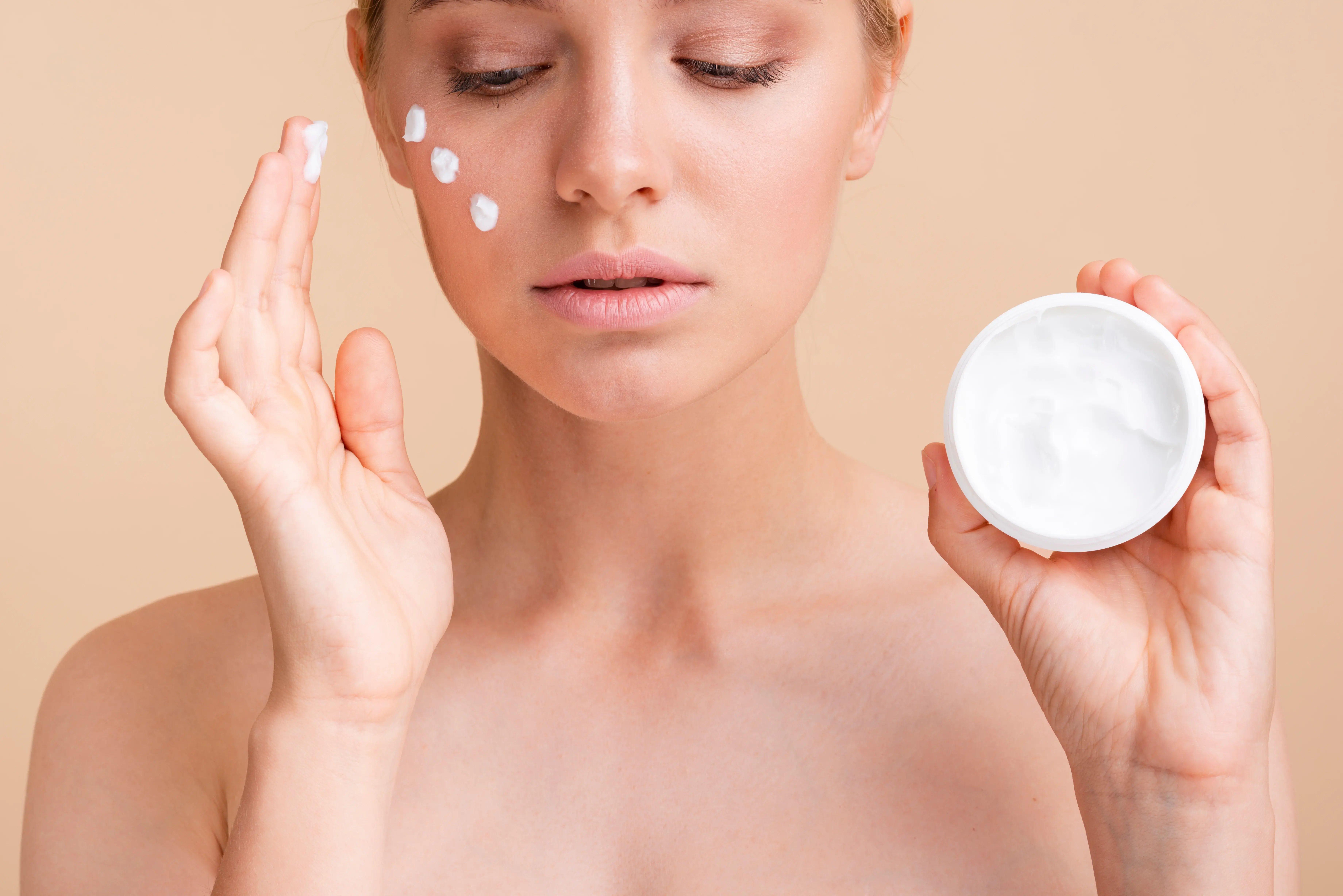 close up of women applying medical grade skincare products