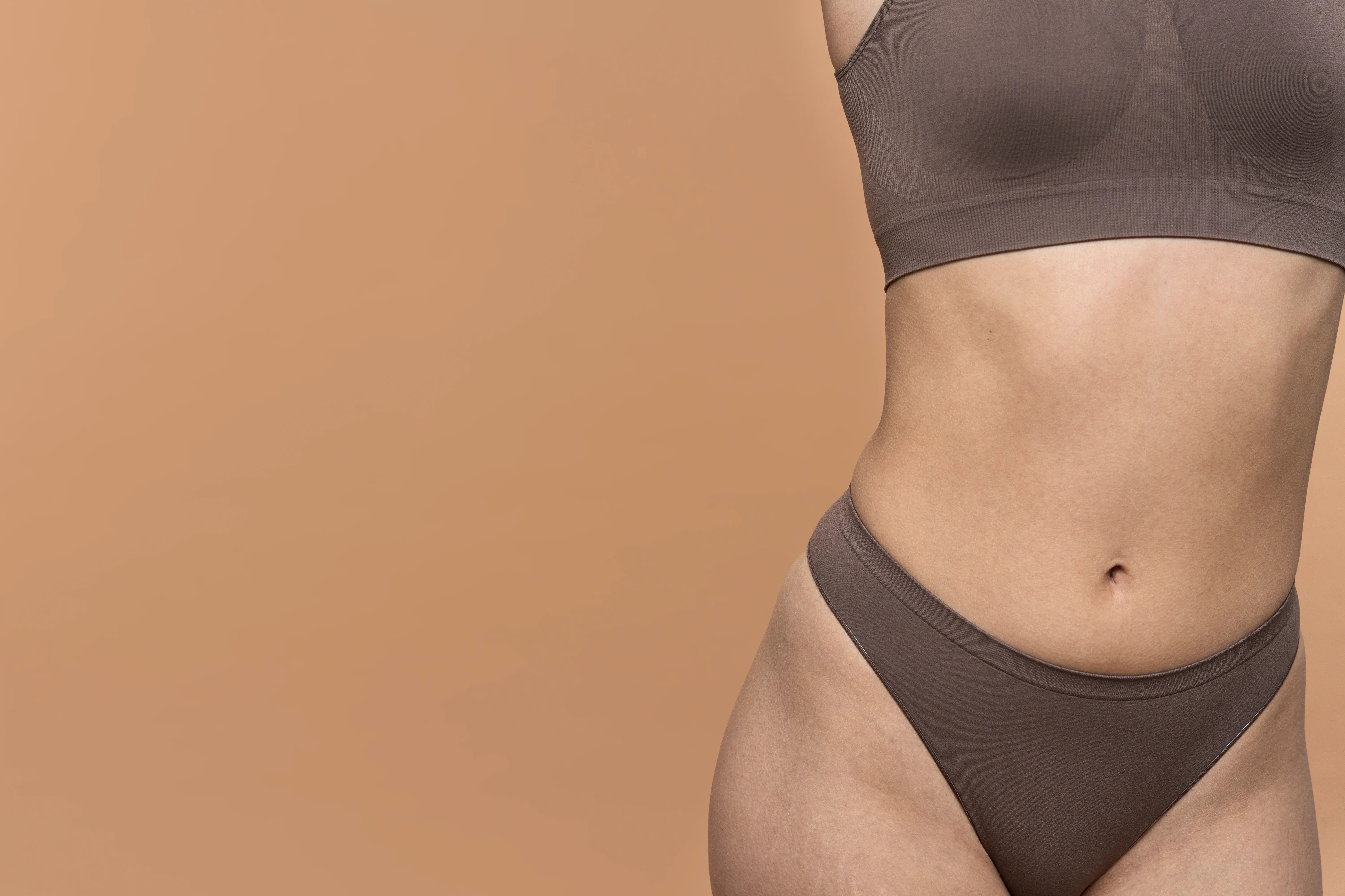 close up of womens body after skin tightening treatment